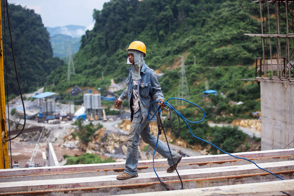 A contruction worker working in Laos.